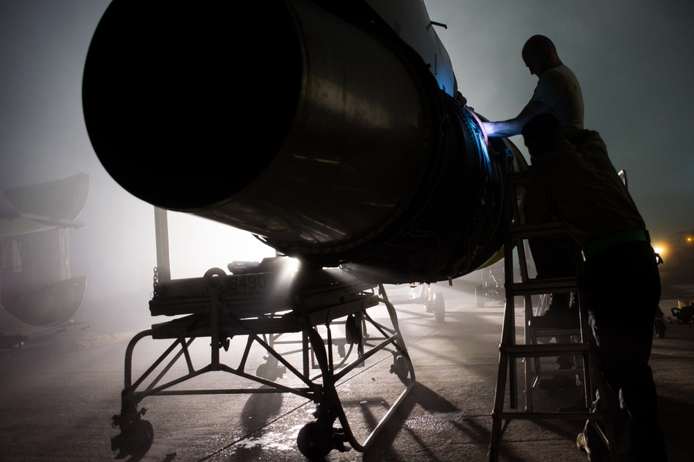 Under heavy fog, deployed maintainers repair aircraft engine in support of CJTF-OIR