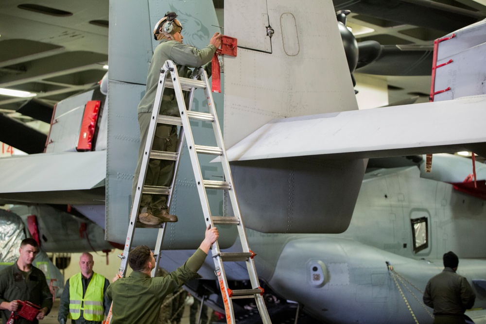 U.S. Marines load MV-22 Ospreys onto commercial ship