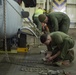 U.S. Marines load MV-22 Ospreys onto commercial ship