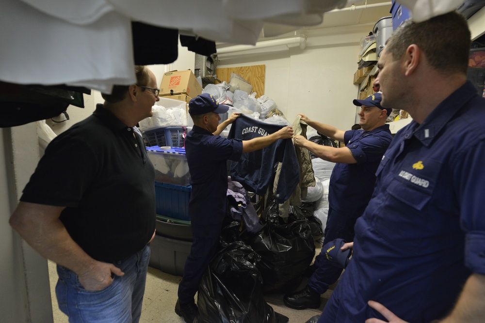 Coast Guardsmen donate to Ozanam Inn