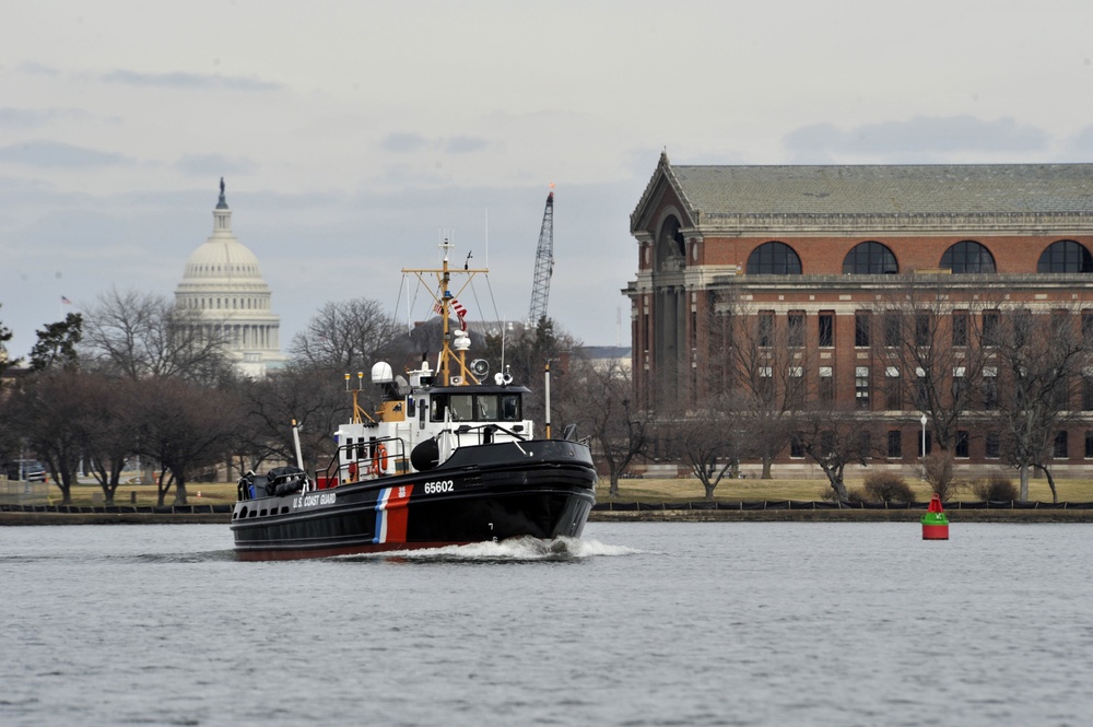 Crewmembers aboard the Coast Guard Cutter Chock enforce a security zone for the 58th Presidential Inauguration