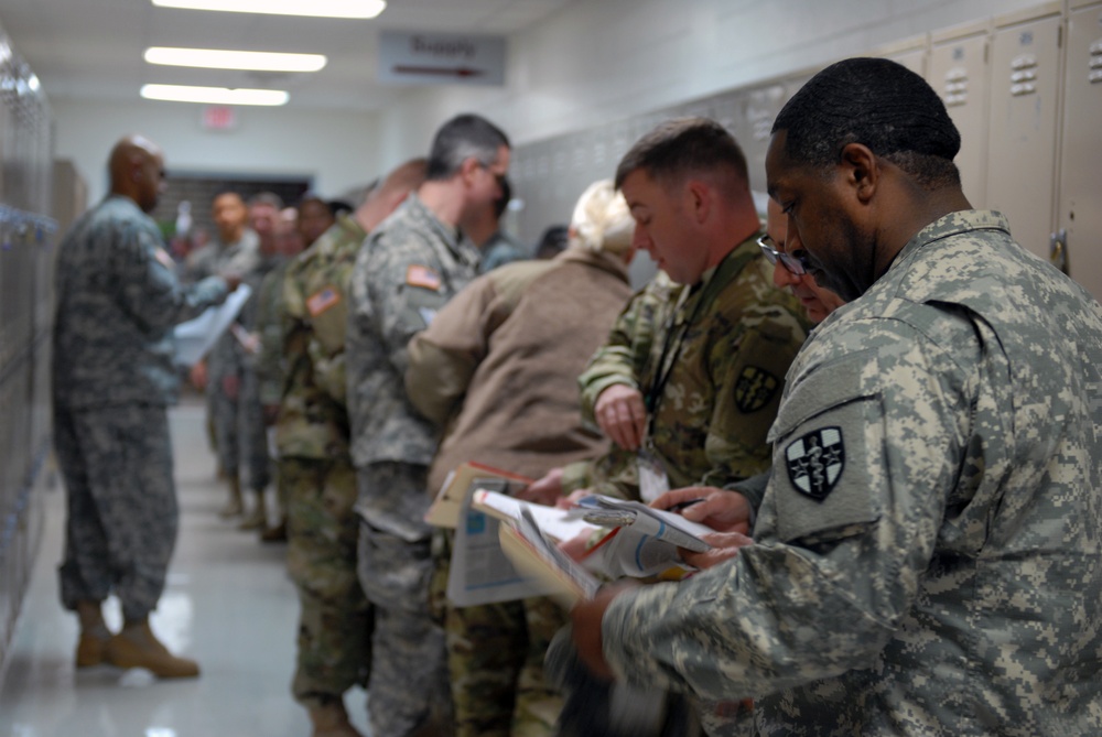 Soldiers prepare paperwork during SRP