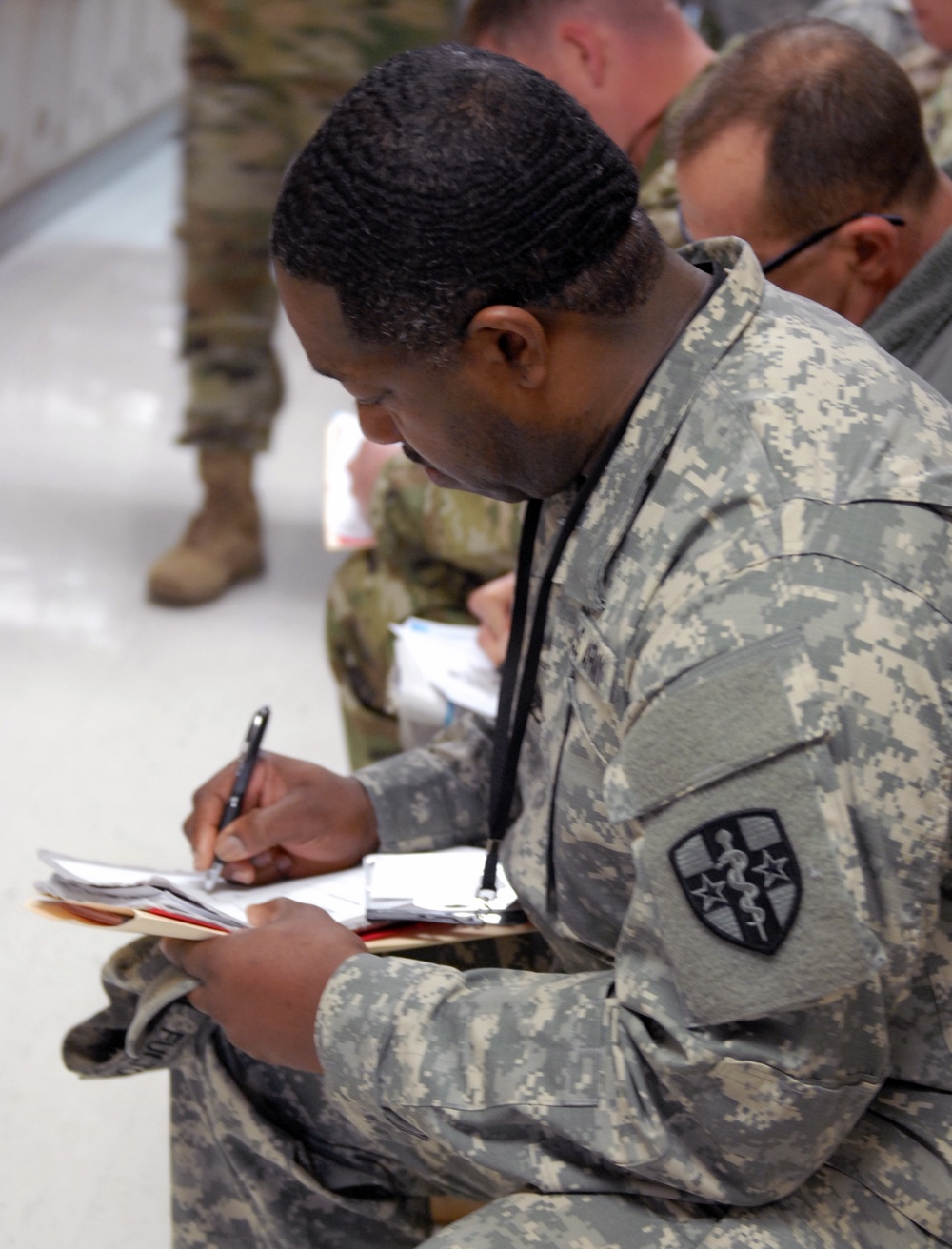 U.S. Army Reserve Soldier prepares paperwork for SRP