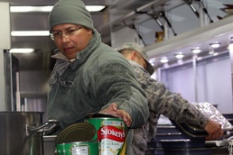 Preparing meals in a Disaster Relief Mobile Kitchen Trailer