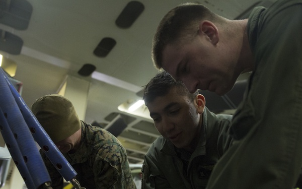 U.S. Marines load MV-22 Ospreys onto commercial ship
