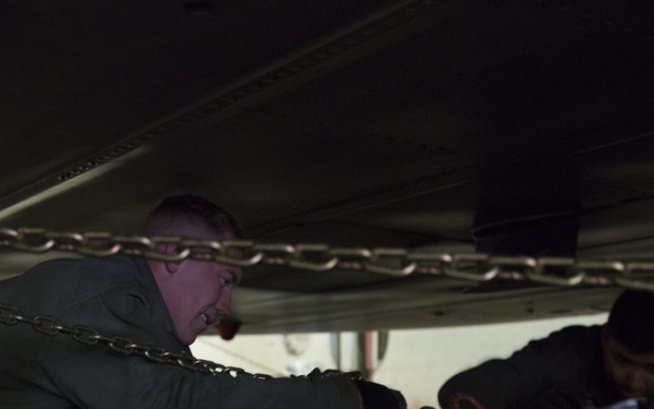 U.S. Marines load MV-22 Ospreys onto commercial ship