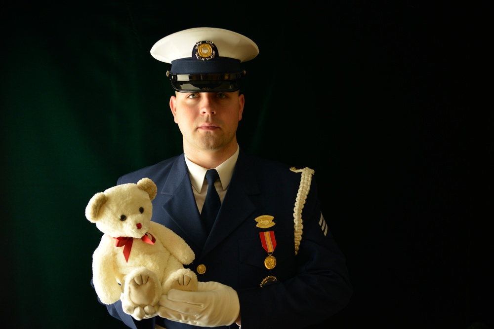 Coast Guard Ceremonial Honor Guard member poses to promote toy drives