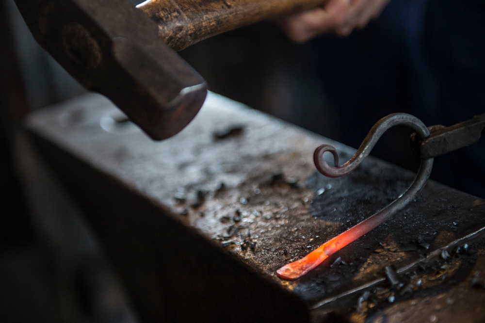Coast Guard Academy cadets learn blacksmithing techniques
