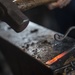 Coast Guard Academy cadets learn blacksmithing techniques