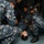 170117-N-DS065-0022 A group of U.S. Navy personnel in digital camouflage uniforms (NWU Type I) are conducting what appears to be a medical training or casualty care drill aboard a naval vessel. One sailor is lying on the deck in a simulated casualty role while several others kneel around them practicing response procedures. Observers stand in the background watching the training exercise.