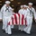 170117-N-BL637-072 A group of U.S. Navy sailors in dress white uniforms are carrying a flag-draped casket during what appears to be a military funeral or burial-at-sea ceremony. The casket is covered with an American flag displaying red and white stripes. The setting appears to be inside or near a large naval vessel, likely an aircraft carrier hangar bay.