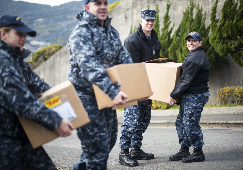 USS Bonhomme Richard (LHD 6) Sailors participate in a Food Drive
