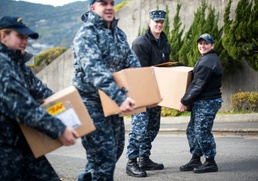 USS Bonhomme Richard (LHD 6) Sailors participate in a Food Drive