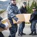 USS Bonhomme Richard (LHD 6) Sailors participate in a Food Drive