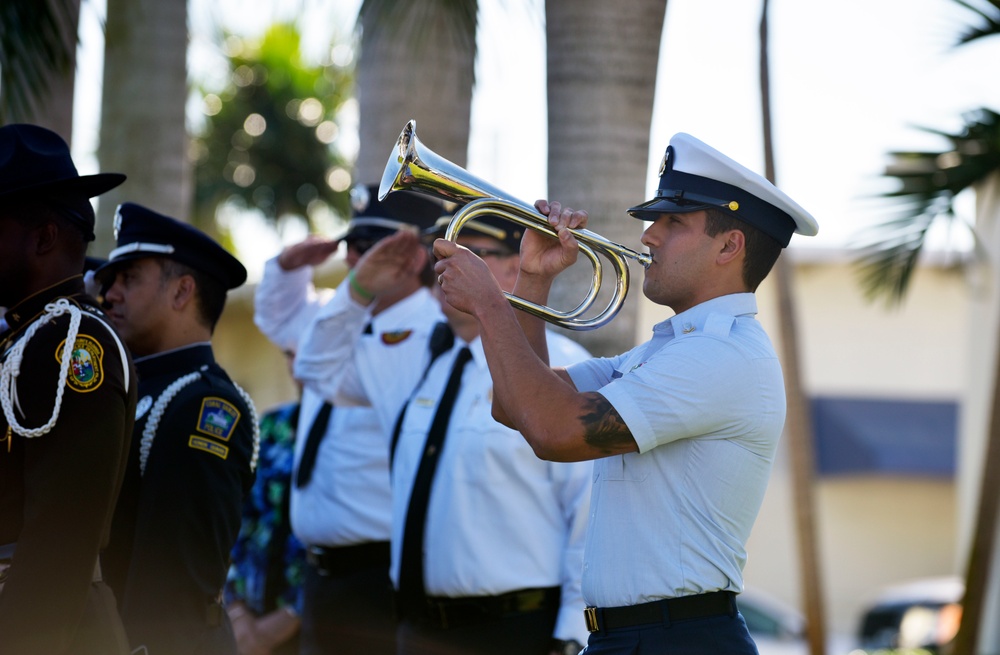 Coast Guardsman plays taps at remembrance ceremony