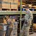 Military Working Dog and Handler Train in a Hangar