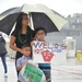 Family Holds 'Welcome Home' Sign for Sailor During USS Topeka Homecoming Jan. 28