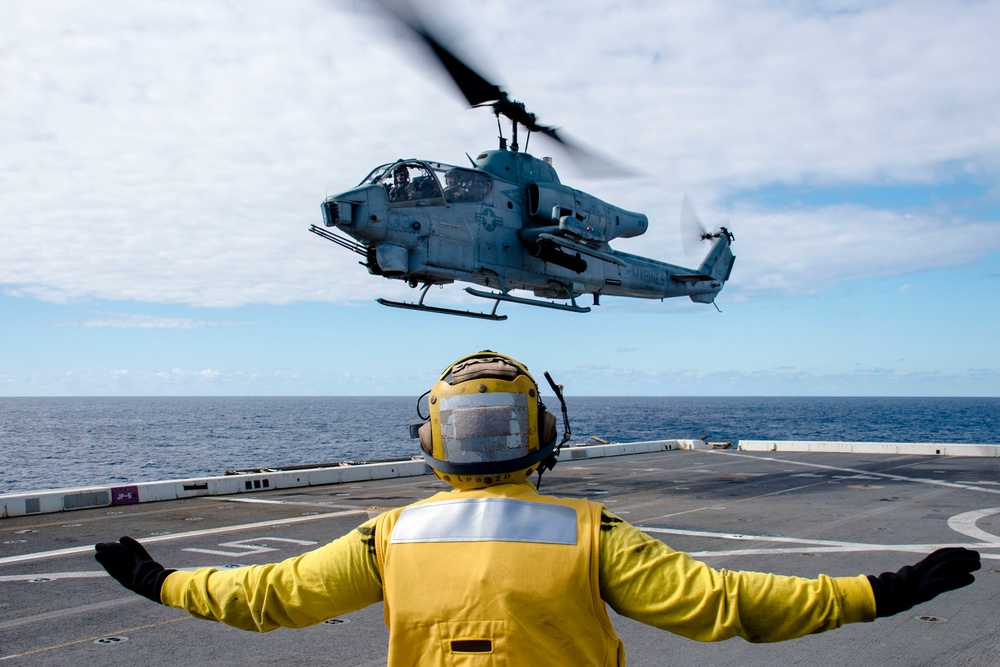 Helicopters land aboard USS Green Bay’s flight deck during patrol