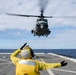 Helicopters land aboard USS Green Bay’s flight deck during patrol