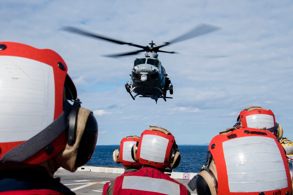 Helicopters land aboard USS Green Bay’s flight deck during patrol