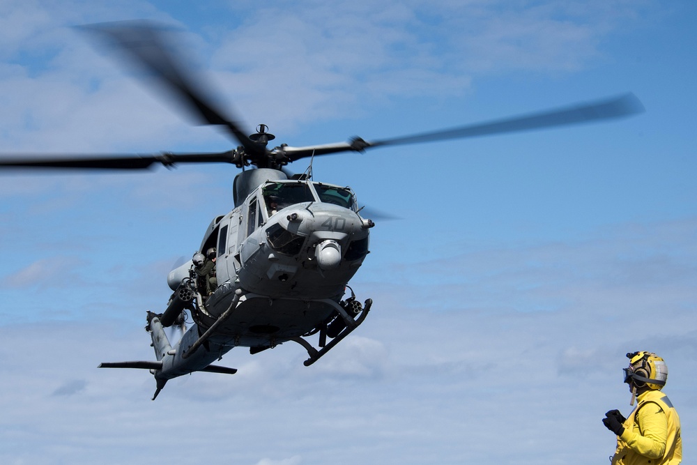 Helicopters land aboard USS Green Bay’s flight deck during patrol