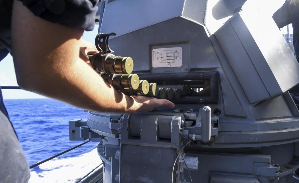 USS Wayne E. Meyer (DDG) Sailors Load Ammunition