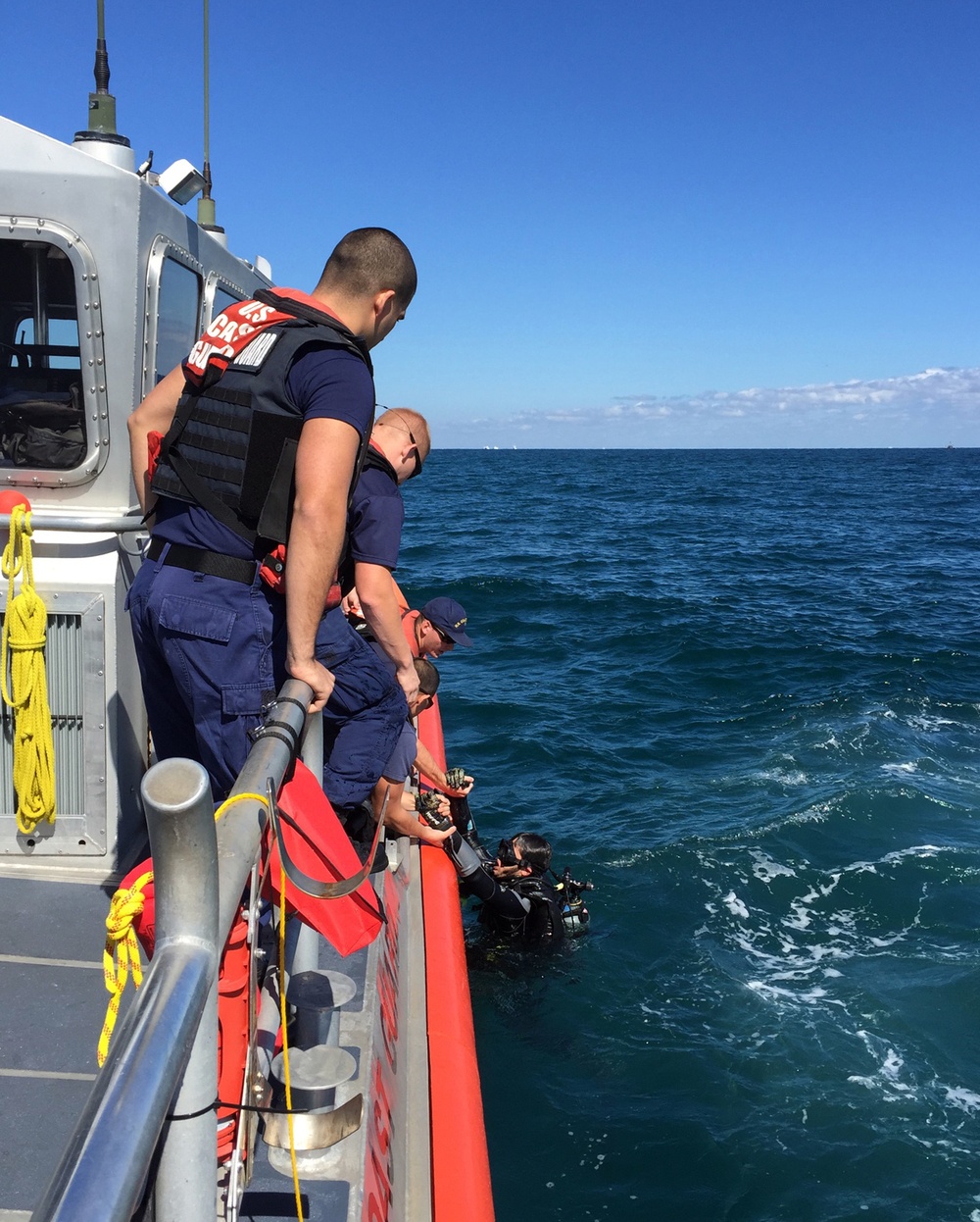 Coast Guard boat crew rescues diver that left sinking vessel
