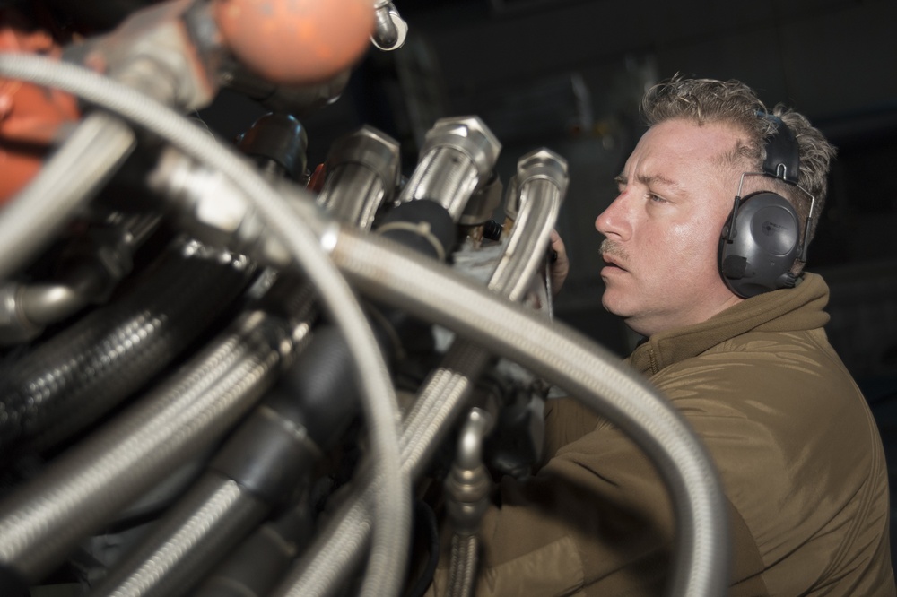 Naval Beach Unit (NBU) 7 Personnel Conduct Maintenance on Landing Craft Air Cushion (LCAC) 21 In the Well Deck of Amphibious Assault Ship USS Bonhomme Richard (LHD 6)