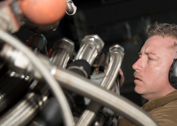 Naval Beach Unit (NBU) 7 Personnel Conduct Maintenance on Landing Craft Air Cushion (LCAC) 21 In the Well Deck of Amphibious Assault Ship USS Bonhomme Richard (LHD 6)