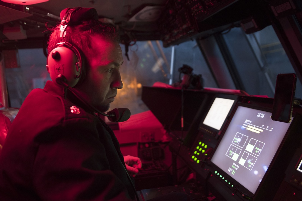 Naval Beach Unit (NBU) 7 Personnel Conduct Maintenance on Landing Craft Air Cushion (LCAC) 21 In the Well Deck of Amphibious Assault Ship USS Bonhomme Richard (LHD 6)