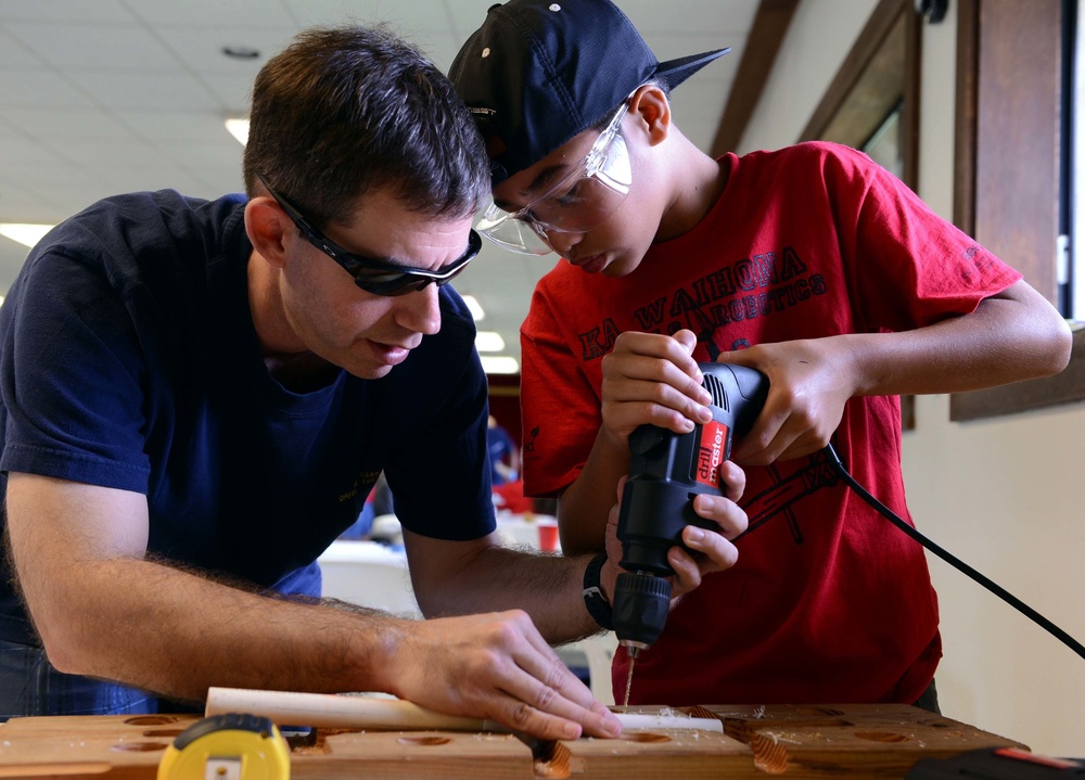 Coast Guard volunteers help students build SeaPerch underwater robots