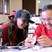 Coast Guard volunteers help students build SeaPerch underwater robots