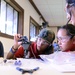 Coast Guard volunteers help students build SeaPerch underwater robots