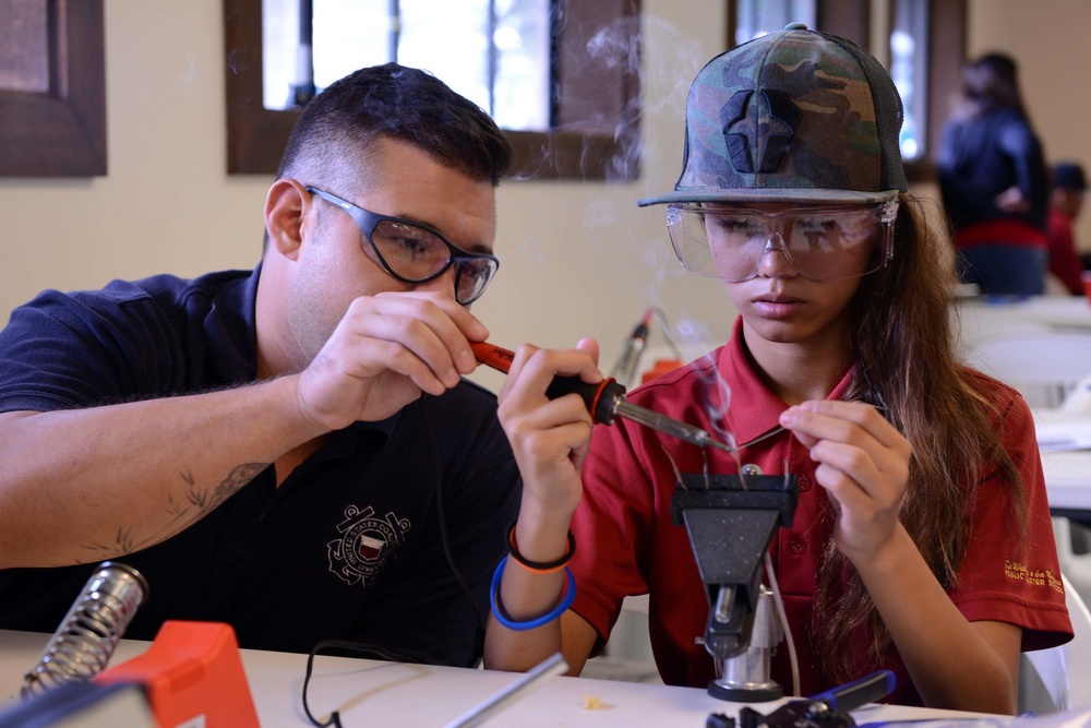 Coast Guard volunteers help students build SeaPerch underwater robots