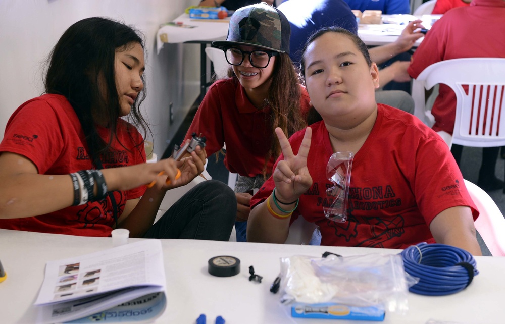 Coast Guard volunteers help students build SeaPerch underwater robots