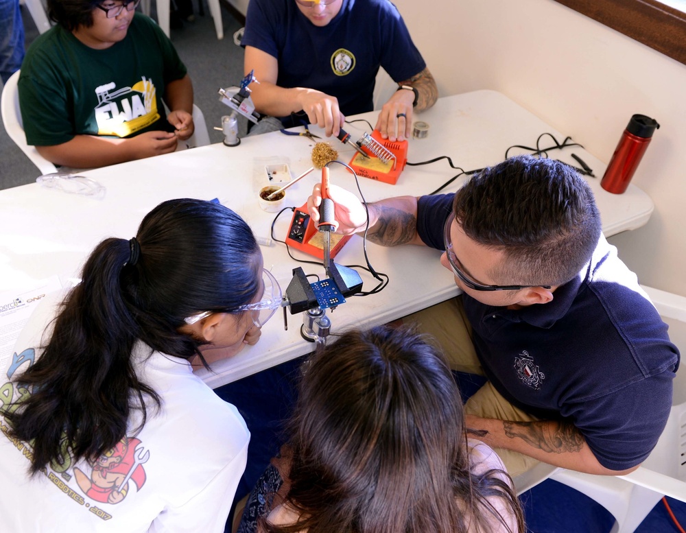 Coast Guard volunteers help students build SeaPerch underwater robots