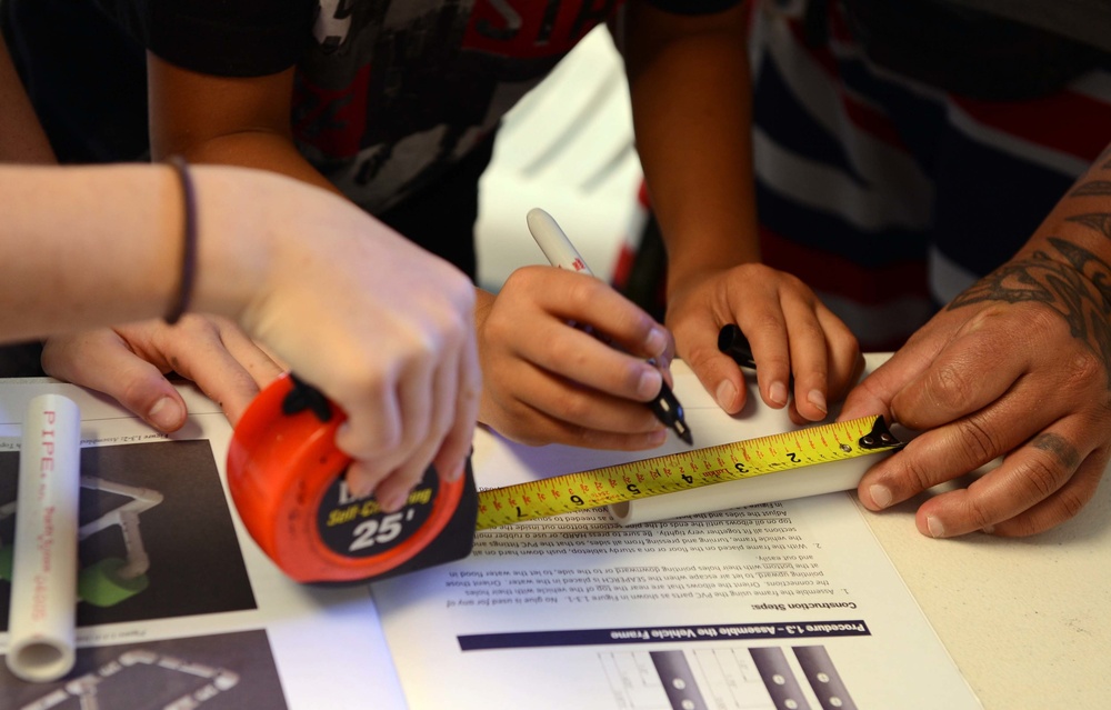 Coast Guard volunteers help students build SeaPerch underwater robots