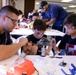 Coast Guard volunteers help students build SeaPerch underwater robots