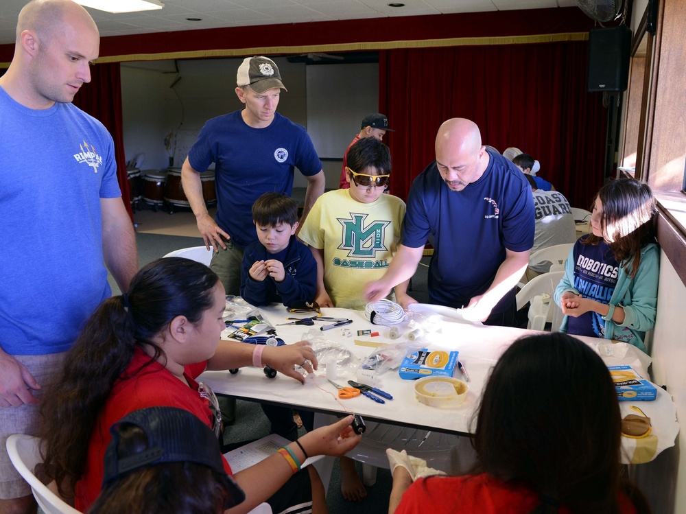 Coast Guard volunteers help students build SeaPerch underwater robots