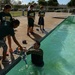 Coast Guard volunteers help students build SeaPerch underwater robots