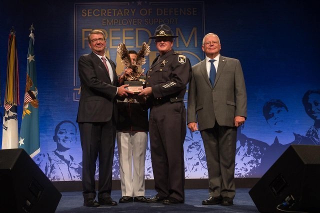 Idaho State Police director Col. Ralph Powell accepts the Freedom Award from Secretary of Defense Ash Carter