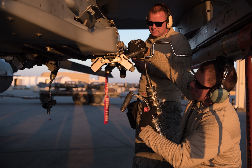 Prepping an F-16 for weapons load