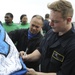 Nimitz Sailors pose with 12th man flag