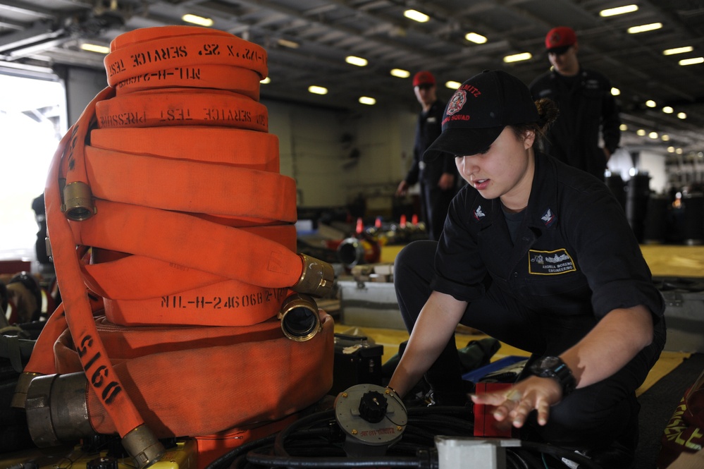 Nimitz Sailor lays out equipment