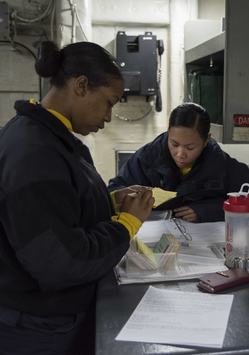 Studying for advancement aboard USS Bonhomme Richard (LHD 6)