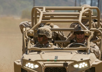 Off-road, expeditionary all-terrain vehicles on their way to infantry Marines