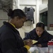 Studying for advancement aboard USS Bonhomme Richard (LHD 6)