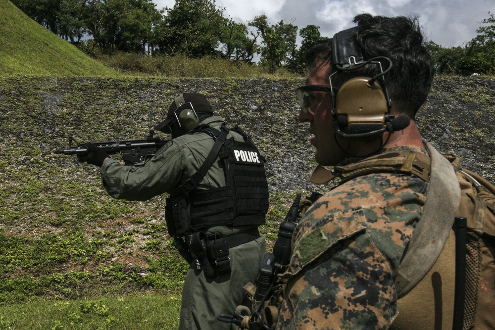 31st MEU Marines, Guam Police Department officers, SWAT team members, shoot down range