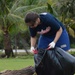 CSS-15 Sailor picks up trash at Eagles Field, Guam, Feb. 3