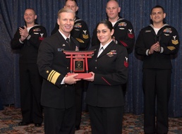 Vice Adm. Joseph Aucoin, Commander, U.S. 7th Fleet, awards the 7th Fleet FY-16 Shore Sailor of the Year